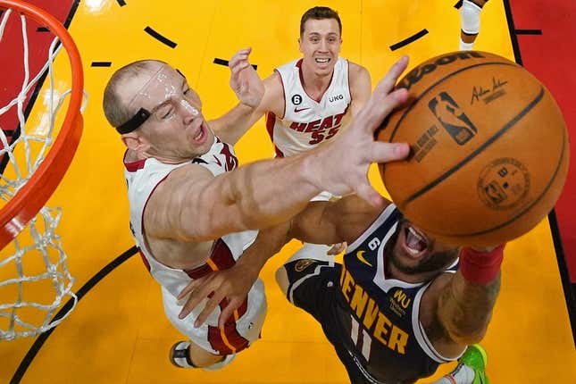 Jun 09, 2023; Miami, FL, USA; Miami Heat center Cody Zeller (44) blocks the shot in the first half of Game 4 of the 2023 NBA Finals at Casea Center A field goal by Denver Nuggets forward Bruce Brown (11).